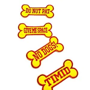 Set of yellow embroidered dog‑bone patches for dog harness communication, including messages “DO NOT PAT,” “GIVE ME SPACE,” “NO DOGS!,” and “TIMID.”