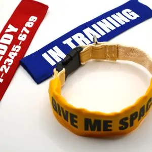 Personalised dog collar sleeve in red,blue, yellow. showing custom printed text, fits 2cm wide collars.